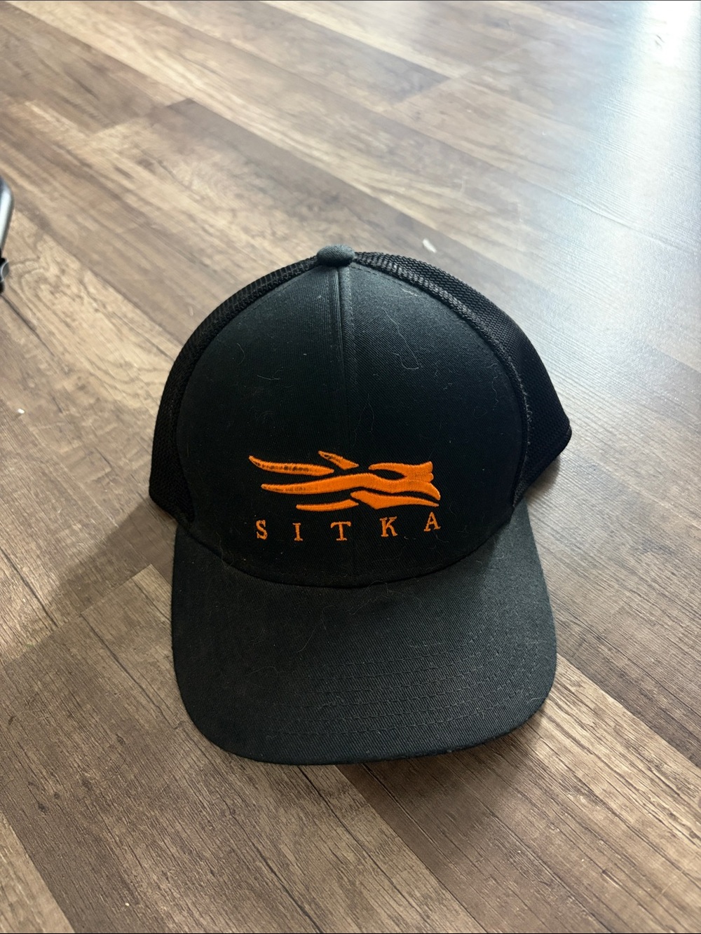 Sitka Men's Black Trucker Hat with Orange Logo